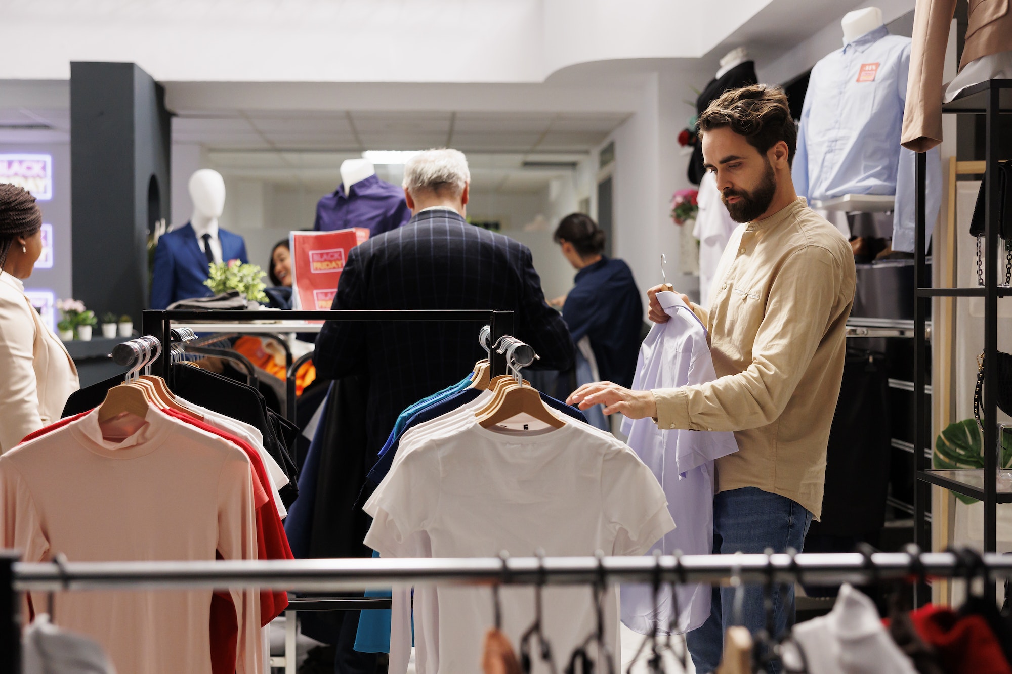 Man buying summer clothes during sales